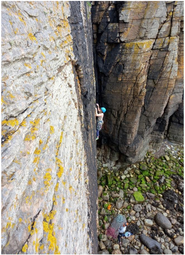 Climbing on the main wall of Latheronwheel at low tide
