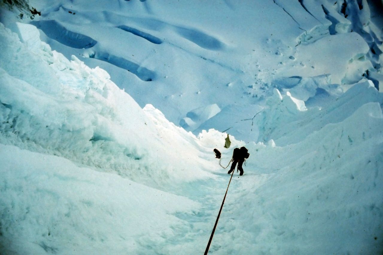 Abseiling back down the face from snow stakes.