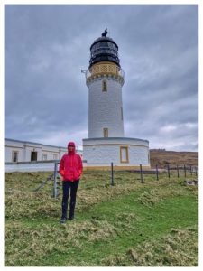 The Cape Wrath lighthouse marks the end of the trail with Rachel looking pleased with herself