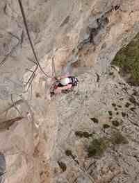 Deb enjoying the steepness of a via ferrata