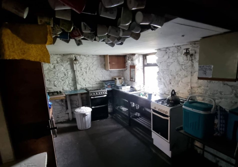 The Carlisle MC hut's kitchen with gas cookers and sink